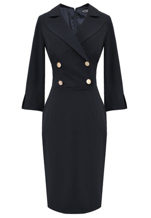 Dwurzędowa czarna sukienka z klapami, złotymi guzikami, rękawami o długości trzech ćwiartek oraz dopasowaną sylwetką zwężającą się na wysokości kolan.