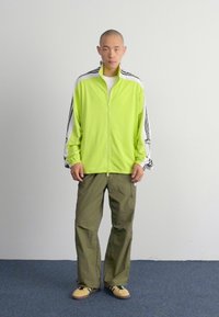 adidas Originals MEGABREAK - Giacca sportiva - bahia glow