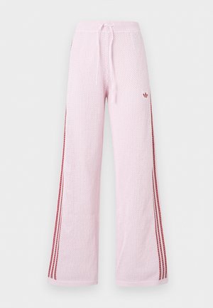 Hellrosa gestrickte Hose mit weitem Bein, roten Seitenstreifen, Kordelzugbund und kleinem Logo am oberen Oberschenkel.