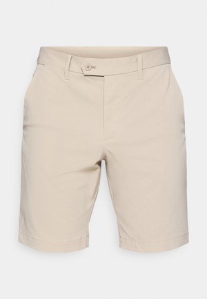 Beige shorts i et tekstureret stof, med flad front, bæltestropper og knaplukning. Afskåret ved midt-lår længde.