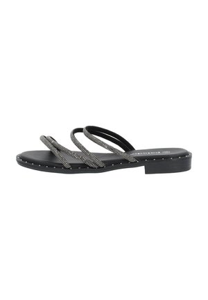 Black flat sandal with three thin rhinestone-studded straps and small silver studs around the sole edge.