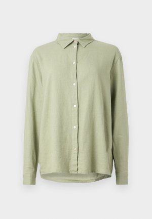 Lichtgroene linnen shirt met een knoopsluiting aan de voorkant, puntige kraag en lange mouwen. Heeft een relaxte pasvorm en een gebogen zoom.