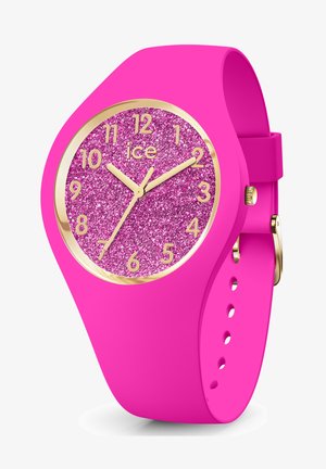 Orologio in silicone rosa con quadrante glitterato rosa, indicatori e lancette dorati, caratterizzato da un design elegante e una chiusura robusta.