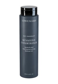 Mörkgrå cylindrisk flaska med svart lock, märkt "SENSITIV BALSAM" och "ANTI-SCHAMPOO." Innehåller 200 ml produkt.