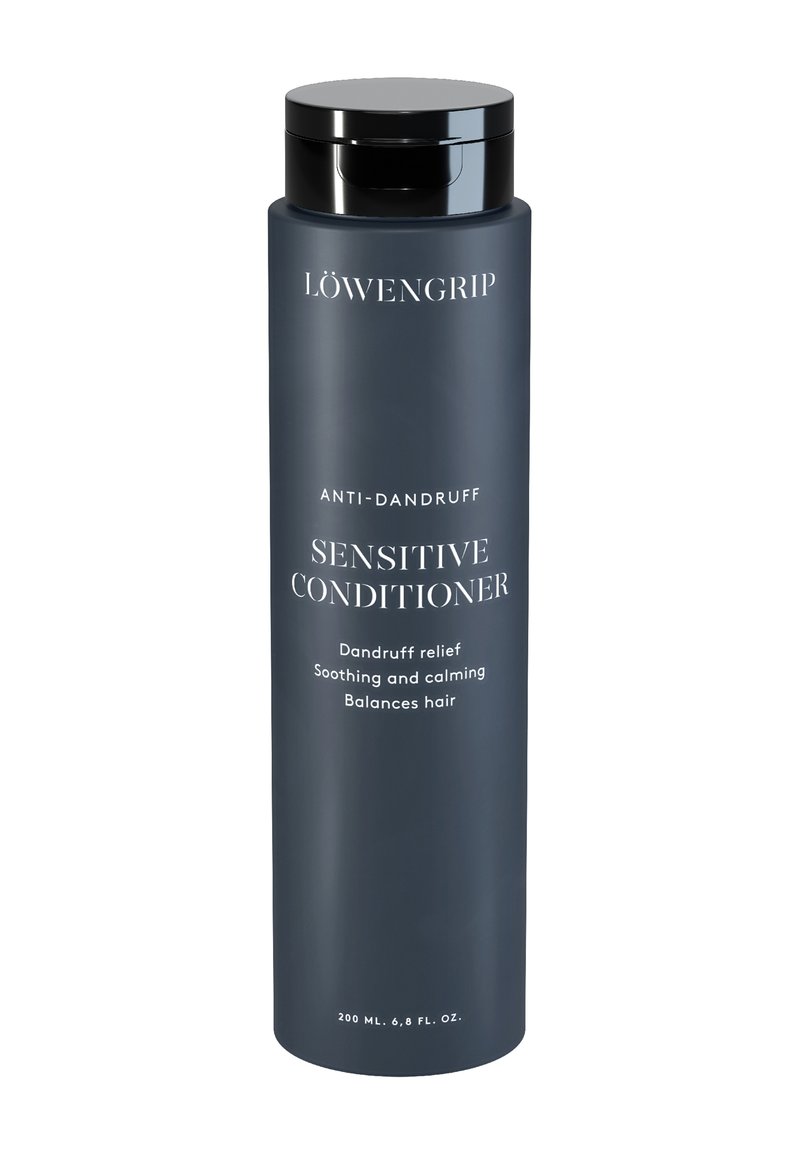 Mörkgrå cylindrisk flaska med svart lock, märkt "SENSITIV BALSAM" och "ANTI-SCHAMPOO." Innehåller 200 ml produkt.