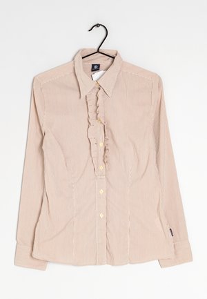 Maglia a maniche lunghe a righe nei toni beige e crema, con chiusura frontale con bottoni, dettaglio di volant lungo la pattina e bottoni dorati.