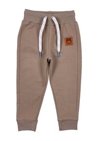 Bruine katoenen joggerbroeken met ribgebreide tailleband, witte en gekleurde trekkoorden en een beer-thema logo patch op de voorkant.