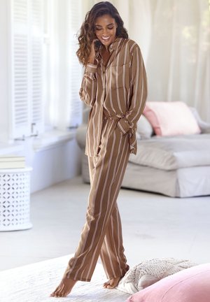 Brown striped loungewear set made of soft fabric; long-sleeve button-up shirt and matching pants with a relaxed fit and side pockets.