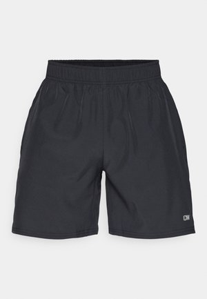 Calções atléticos pretos com um cinto elástico, textura suave e um discreto logotipo na parte inferior direita.