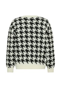 Black and white houndstooth patterned sweater, featuring a cozy knit texture, long sleeves, and ribbed cuffs and hem.