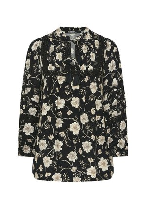 Blusa negra de manga larga con un patrón floral en crema y beige, con cuello redondo, detalle de lazo y sutiles acentos de encaje.