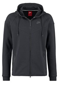 Svart Nike zip-up hoodie med huva, snörning, två blixtlåsfickor och diskret Nike-logga på bröstet.