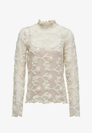 Blouse transparente à manches longues en rose pâle avec broderie florale blanche. Comprend un col montant à volants et un ourlet festonné.