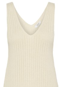 Haut sans manches tricoté de couleur crème avec encolure en V et une subtile texture côtelée verticale sur le tissu.