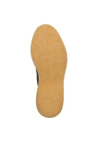 Suola di scarpa marrone con una superficie texturizzata, forma arrotondata e uno strato in gomma gialla spesso e resistente. Design minimalista senza motivi visibili.