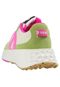 Green and pink sneaker featuring a mesh upper, suede accents, a textured white sole, and a branded pink tab on the heel.