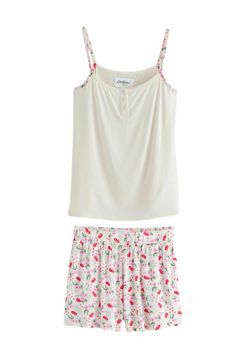 Camisole crème clair avec des bretelles florales et un devant boutonné, associé à un short blanc avec un motif de cerises roses et de feuilles.