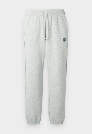 Pantaloni della tuta grigi in tessuto morbido, con vita elastica con coulisse, polsini aderenti e dettaglio logo sulla coscia.