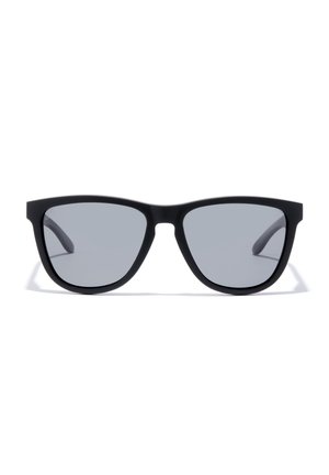 Black sunglasses with a matte frame, grey lenses, angular shape, and slender arms. No visible logos or embellishments.