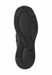 Semelle de chaussure en caoutchouc noir avec une surface texturée, un motif de semelle pour une meilleure adhérence et une zone de rembourrage centrale pour le confort.