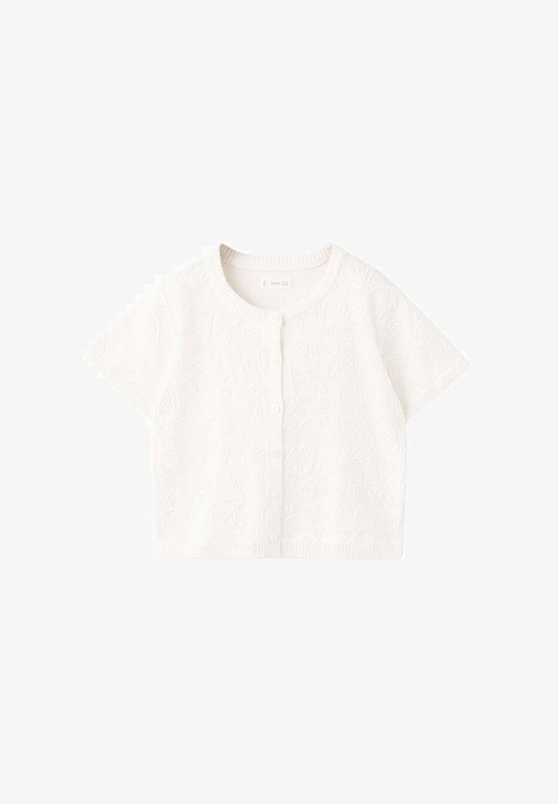 Cardigan blanc à manches courtes en tissu texturé avec un motif floral et une fermeture à boutons sur le devant. Encolure ronde et ourlet côtelé.