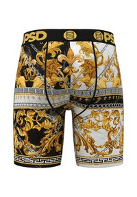 Boxer de tipo slip con una cinturilla negra que presenta el logo "PSD" en dorado. La tela muestra intrincados patrones de leones dorados y flores sobre un fondo blanco.