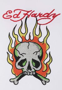 White t-shirt featuring a rhinestone skull design with green accents and flames in red, orange, and yellow. Text reads "Ed Hardy."