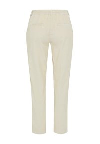 Crème-kleurige corduroy broek met een elastische tailleband, taps toelopende benen en twee achterzakken. Verticale ribbelstructuur over de gehele broek.