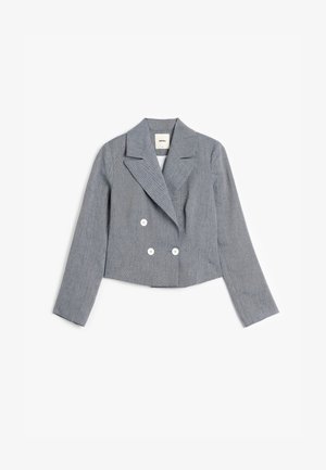 Gekürzter zweireihiger Blazer aus strukturiertem blauen Stoff. Mit Reverskragen und zwei weißen Knöpfen auf der Vorderseite. Lange Ärmel.