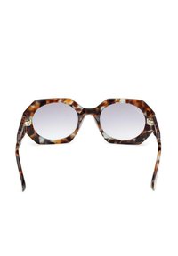 Occhiali da sole oversized in acetato tartarugato con lenti grigie chiare sfumate e stanghette sottili.