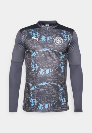 Long sleeve sports top featuring a half-zip collar, a grey and blue patterned design, with a logo on the chest and textured sleeves.