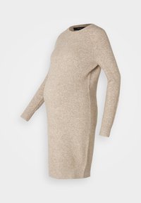 Abito premaman lavorato a maglia beige con maniche lunghe, scollatura rotonda e vestibilità comoda, progettato per adattarsi a una pancia che cresce.