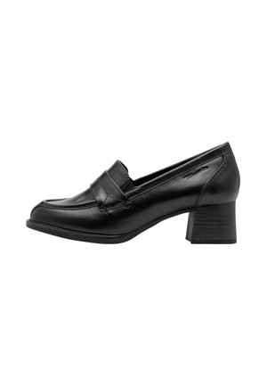 Mocassin femme en cuir noir avec petit talon bloc et détails de coutures, vu de profil sur fond blanc.