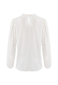 Blusa bianca a maniche lunghe concollo alto, dettaglio a occhiello sul retro e ricami sulle maniche. Tessuto morbido e liscio.