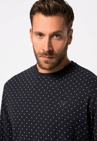 Granatowy sweatshirt wykonany z bawełny, z wzorem w kropki, okrągłym dekoltem i małym logo na piersi. Miękka tekstura.