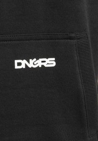 Black sweatshirt fabric featuring a front pocket and white "DNGRS" logo. The texture is smooth with ribbed accents at the edges.