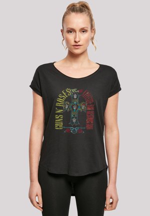 Black short-sleeve t-shirt with a round neckline and graphic print featuring skulls, roses, and text in colorful lettering. Soft fabric, relaxed fit.