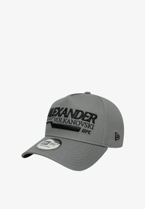 Gray cap with an adjustable strap, featuring embossed black text: "ALEXANDER VOLKANOVSKI UFC." Smooth fabric with a curved brim.