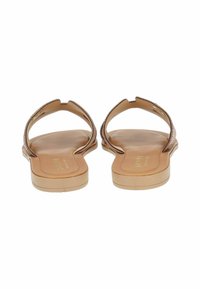 Brown flat sandals with a textured upper and smooth sole. Feature a thong design and open back, made from synthetic material.