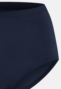 Navyblå bomullsunderklänning med en slät yta, hög midja och utan synliga sömmar; har ett mjukt, elastiskt midjeband.