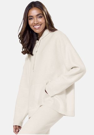 Beige übergroßer Hoodie mit Kordelzug, Fronttasche, gerippten Bündchen und Saum. Weiches Material und lockere Passform für zusätzlichen Komfort.