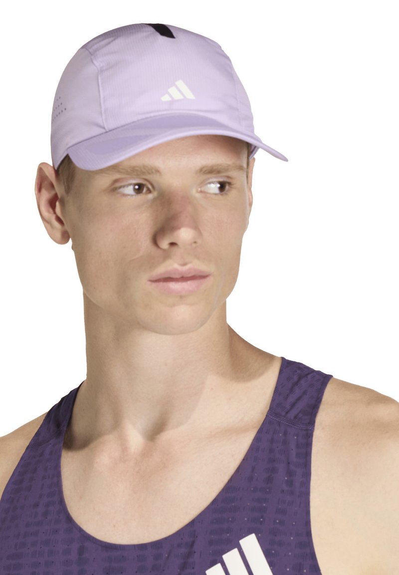 Light purple athletic cap with a curved brim, featuring a black accent and white logo. Worn by a model against a white background.