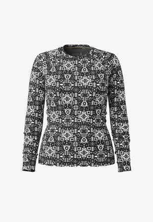 Camisa de manga larga en negro y blanco con un patrón geométrico, cuello redondo y tejido texturizado. Presenta mangas y dobladillo ajustados.