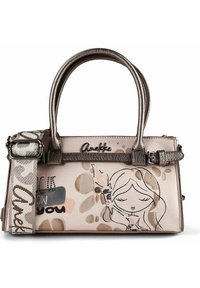 Beigefarbene Handtasche mit metallischen Griffen, abnehmbarem Riemen, Illustration eines Cartoon-Mädchens und "Anekke"-Logo auf der Vorderseite.