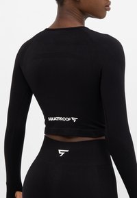 SQUATPROOF LONG SLEEVE RUSH+ SEAMLESS CROPPED LONG SLEEVE  - Langarmshirt - black