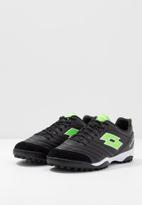 Lotto STADIO 300 II TF - Voetbalschoenen voor kunstgras - all black/spring green