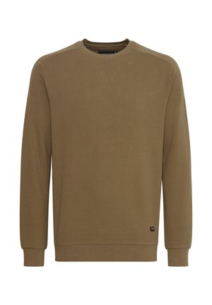 Ruskea pitkähihaine neule, joka on valmistettu tekstiilistä, jossa on pyöreä kaula-aukko ja ribbaus hihansuissa. Täydennä ilmettä pienellä logolla helmassa.