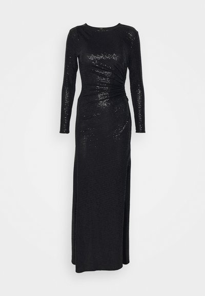 Abito lungo nero realizzato in tessuto testurizzato con paillettes, caratterizzato da maniche lunghe, un corpetto aderente e uno spacco laterale per facilitare i movimenti.