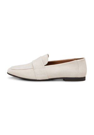 Lysebeige læder slip-on loafer med lav sort hæl og bred strop hen over toppen, vist fra siden på hvid baggrund.