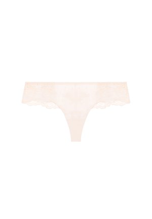 Beige blondeg-strengtrusse med blomsterbroderi og bølgede kanter, vist fladt på en hvid baggrund.